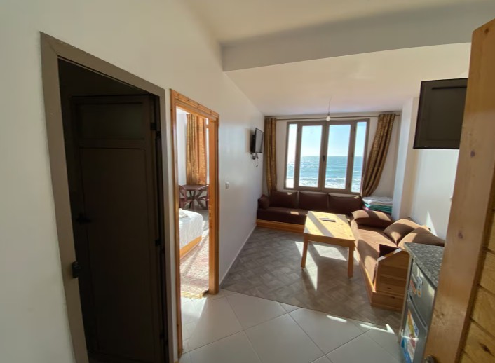 Living area with sofas and an ocean-facing window